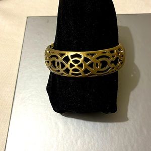 Gold tone bracelet- opening is a hinged clasp